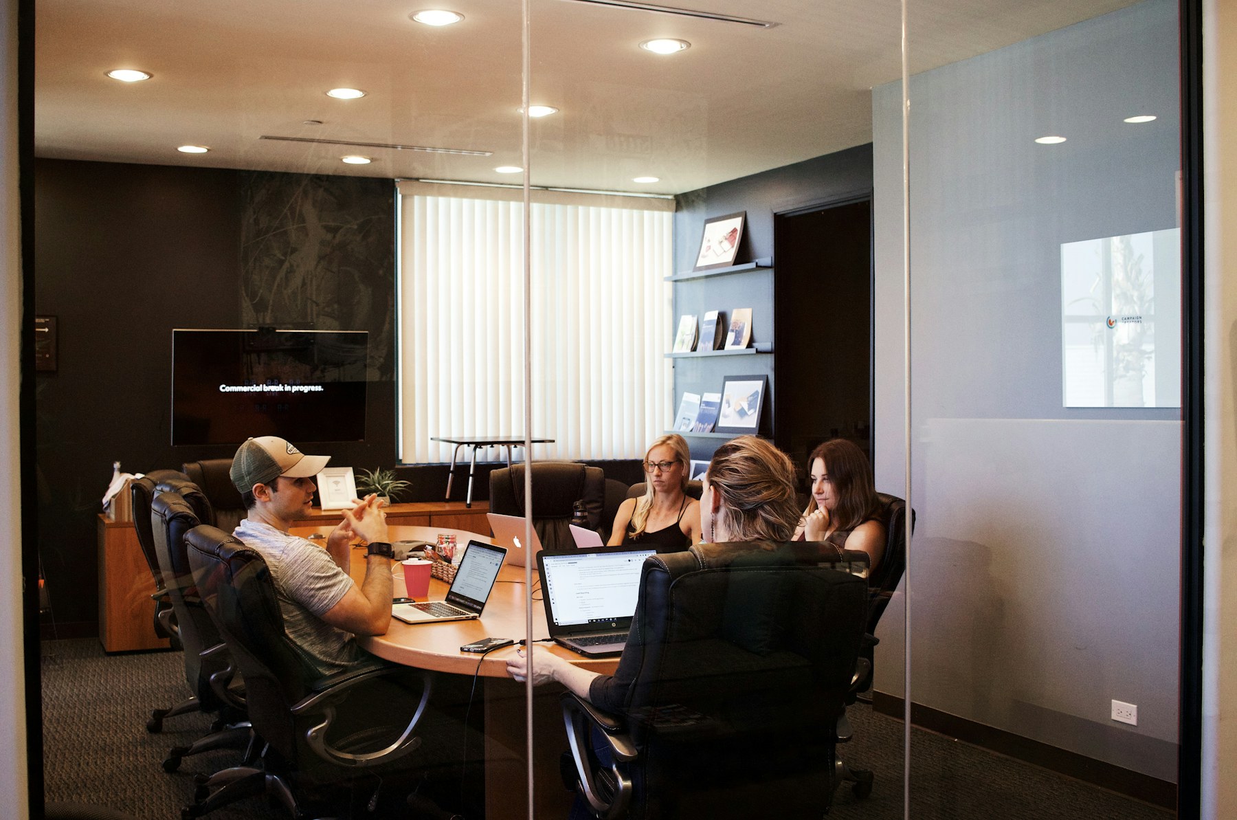 Professional adviser presenting to a meeting table
