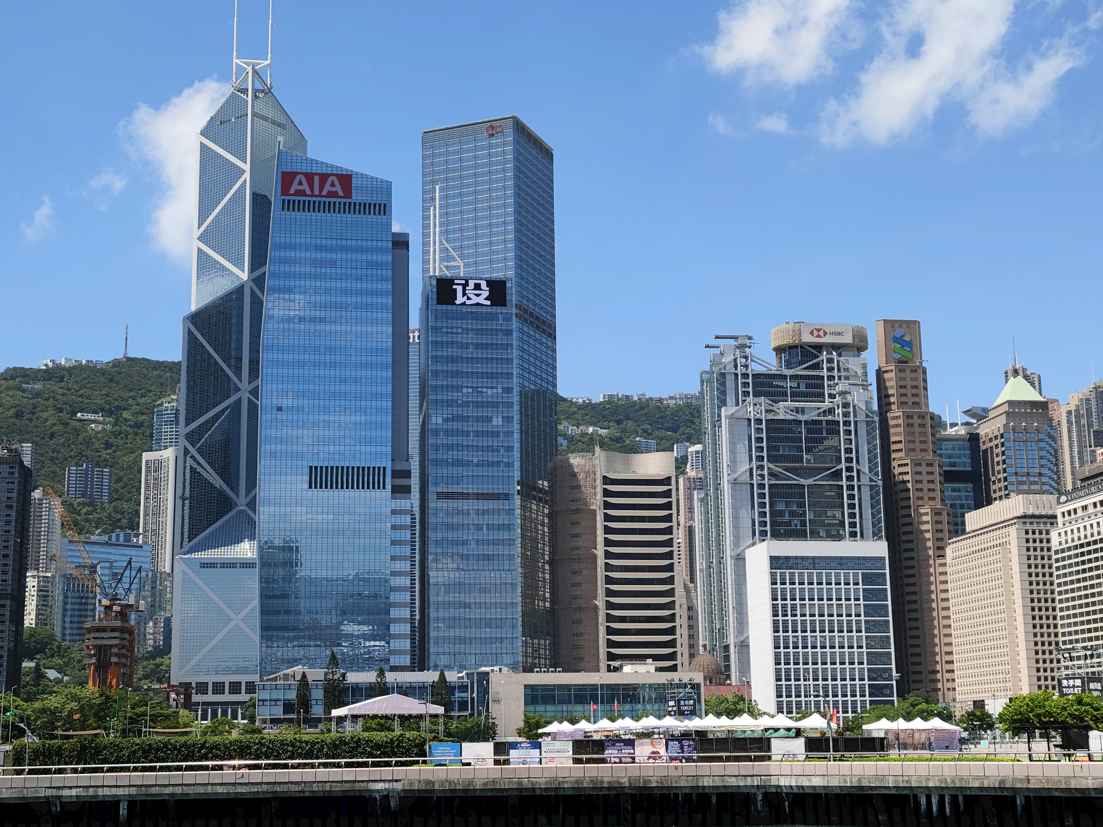 Central Hong Kong financial district towers under a blue sky